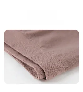 Macro detail of the seamless elastic waistband on thin pink safety shorts for women