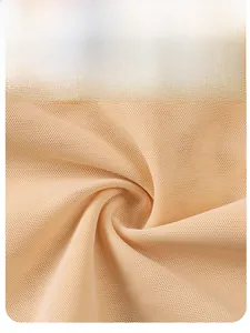 Detail of nude high-stretch mesh fabric with breathable micro-holes for shapewear