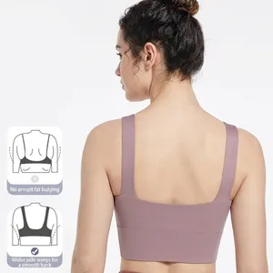 Women's padded sports bra in dusty rose with wide straps and seamless back design