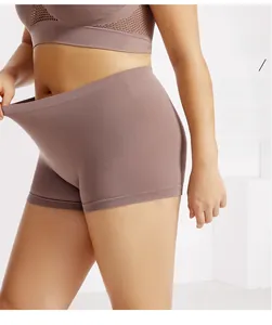 Detail showing high-elastic seamless fabric stretching on mauve safety shorts