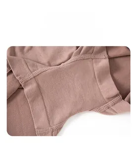 Detailed view of seamless stitching and precision crotch seams on brown stretch safety shorts
