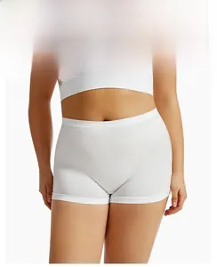 Close-up of white high-waisted seamless safety shorts in breathable knit fabric on a model
