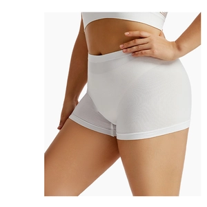 Side view of white high-waist seamless safety shorts with tummy control on a model