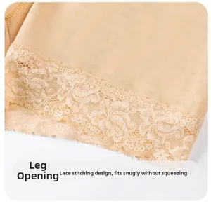 Detail of breathable mesh fabric and delicate lace trim on seamless body shaper shorts