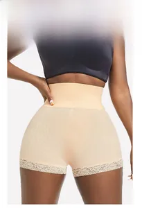 Detail of high waist shapewear with lace trim and breathable mesh fabric on model