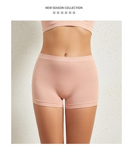 Close-up of seamless pink plus-size safety shorts with wide elastic waistband detail