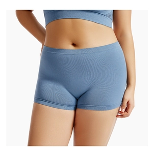Detail of blue high waist seamless safety shorts with elastic knit fabric on model