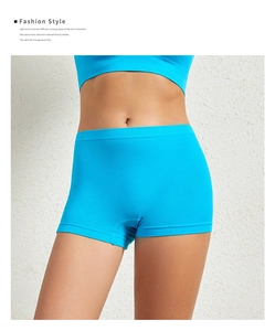 Detail view of high-elasticity blue safety shorts with tummy control shaping effect