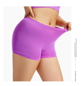 Macro detail showing the high elasticity and seamless ribbing of purple safety shorts