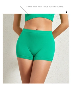 Detail of high-waist seamless shaping shorts in vibrant green fabric for tummy control