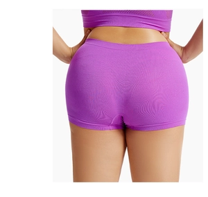 Detail view of purple seamless safety shorts with ribbed texture on a model