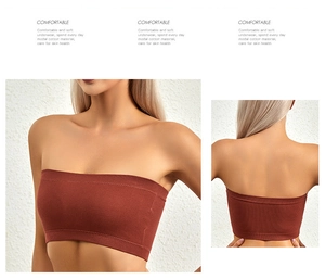 Detailed macro view of the seamless ribbed texture and soft modal cotton fabric in brick red