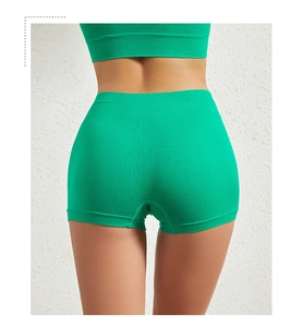 Rear view of high-waist seamless ribbed green safety shorts with elastic texture