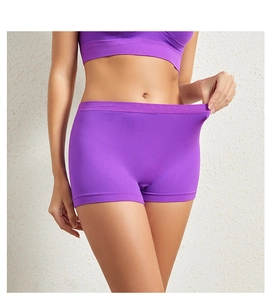 Detail showing the high elasticity of purple seamless safety shorts with a waist pull test