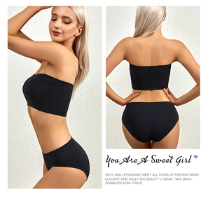 Detail view of seamless black ribbed tube top set showing side and back fit on model