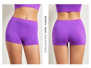 Detail of high-stretch purple yoga shorts with peach buttock lift effect and slim fit