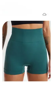 Detail of high-waist seamless yoga shorts with wide ribbed waistband in dark green fabric