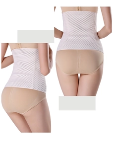 Detail of white breathable mesh waist trainer showing high waist corset fabric texture