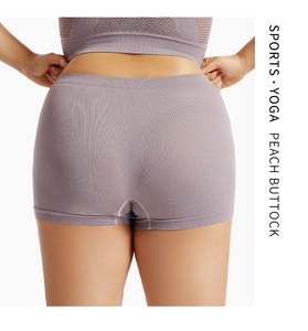Detail of gray-purple seamless yoga shorts showing ribbed texture and lifting effect