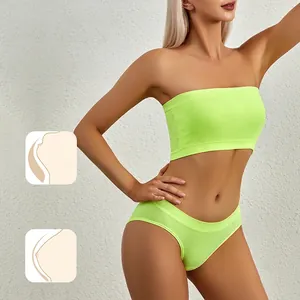 Neon green seamless ribbed tube top and matching panty set on model with minimalist background