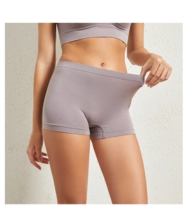 Detail of high-stretch seamless safety shorts in mauve showing fabric elasticity and texture