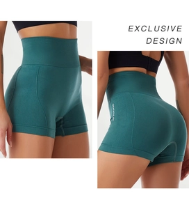 Detail of high-waist yoga shorts with wide tummy control waistband and ribbed texture