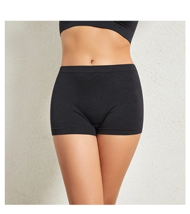 Detailed view of seamless high-waist black boyshorts with tummy control texture