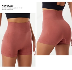 Detail of high-waisted seamless yoga shorts showing shaping effect and knit texture