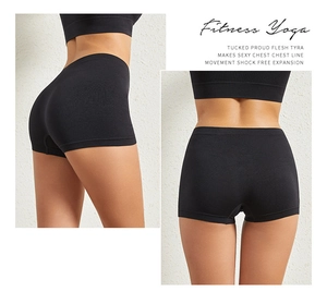 Detail view of high waist black seamless yoga shorts with push up effect and snug fit
