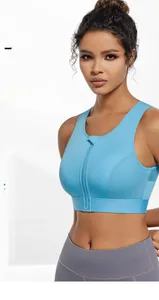 Detailed close-up of blue sports bra with front zipper and breathable mesh fabric