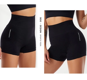 Close-up of high-waisted black yoga shorts featuring breathable fabric and seamless design