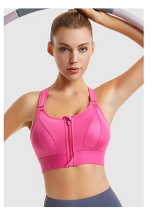 Close-up of zip-front sports bra in rose red with adjustable straps and mesh panels