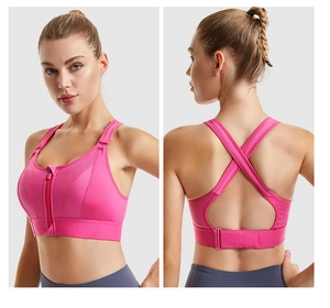 Detailed view of the front zipper and cross-back straps on the purple sports bra