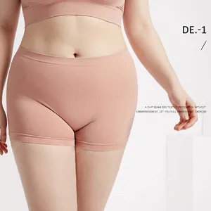 Seamless nude sport set with cropped tank top and high-waisted shorts for yoga fitness