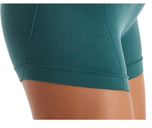 Close-up of seamless dark green yoga shorts showing high-elastic ribbed knit fabric texture