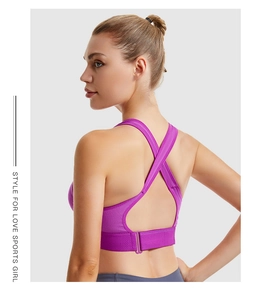 Detail of purple sports bra featuring X-shaped cross back design and breathable mesh fabric