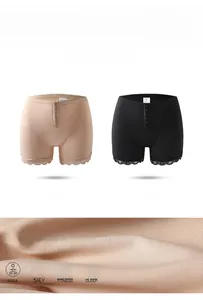 Detail of high-waisted shaping shorts featuring lace trim and adjustable hook closure