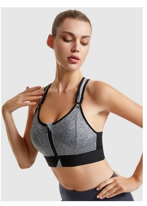 Detailed view of the front zipper closure and textured gray fabric on sports bra