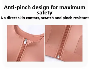 Detailed view of the anti-pinch zipper guard on the front of a pink sports bra