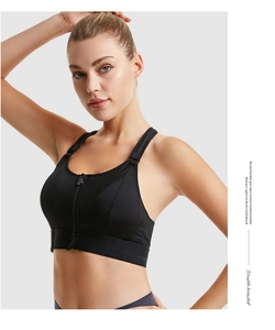 Detail of breathable mesh texture and front zipper closure on black sports bra
