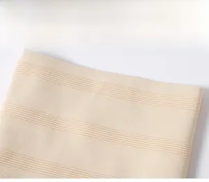 Close-up of beige high-waist shaping panties with high-density elastic striped fabric