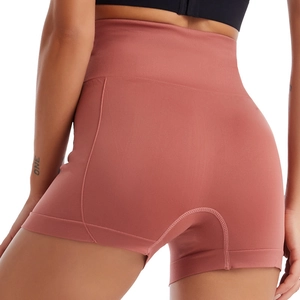 Seamless high-waist yoga shorts in brick red with compression band and lift effect
