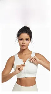 Detailed view of white high-impact sports bra with front zipper closure and wide straps