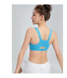 Detail view of sky blue racerback sports bra with adjustable straps and wide back buckle