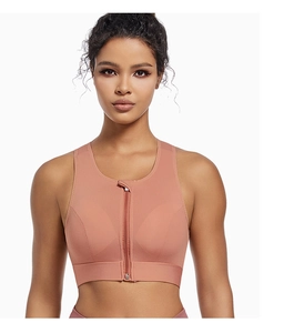 Close-up of pink high-impact sports bra featuring front zipper and breathable mesh side fabric