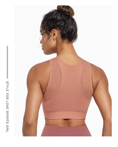 Detail of breathable mesh back on dusty pink high-impact sports bra for running
