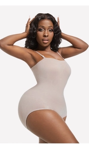 Detail of nude ribbed compression bodysuit with thin adjustable straps and seamless fit