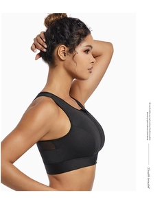 Detailed side view of black high-impact sports bra with front zipper and mesh panels