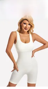 Close-up of white ribbed bodysuit showing wide straps and supportive fabric texture
