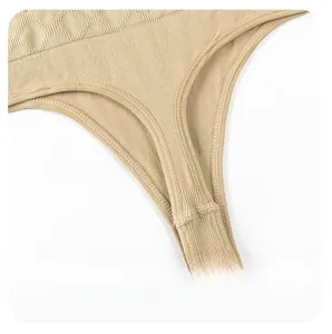 Detail view of beige thong showing knitted ribbed texture and seamless crotch design